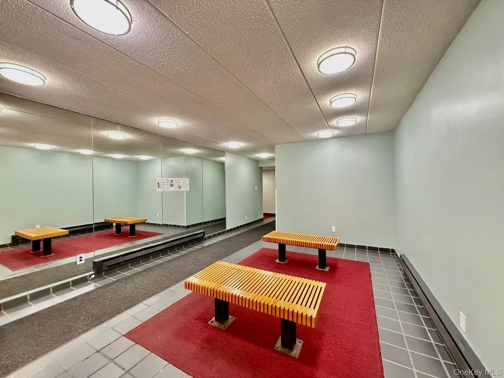 42-42 Union Street, Unit 9PHC Queens, NY 11355 - Photo 15 of 21 a room with gym equipment