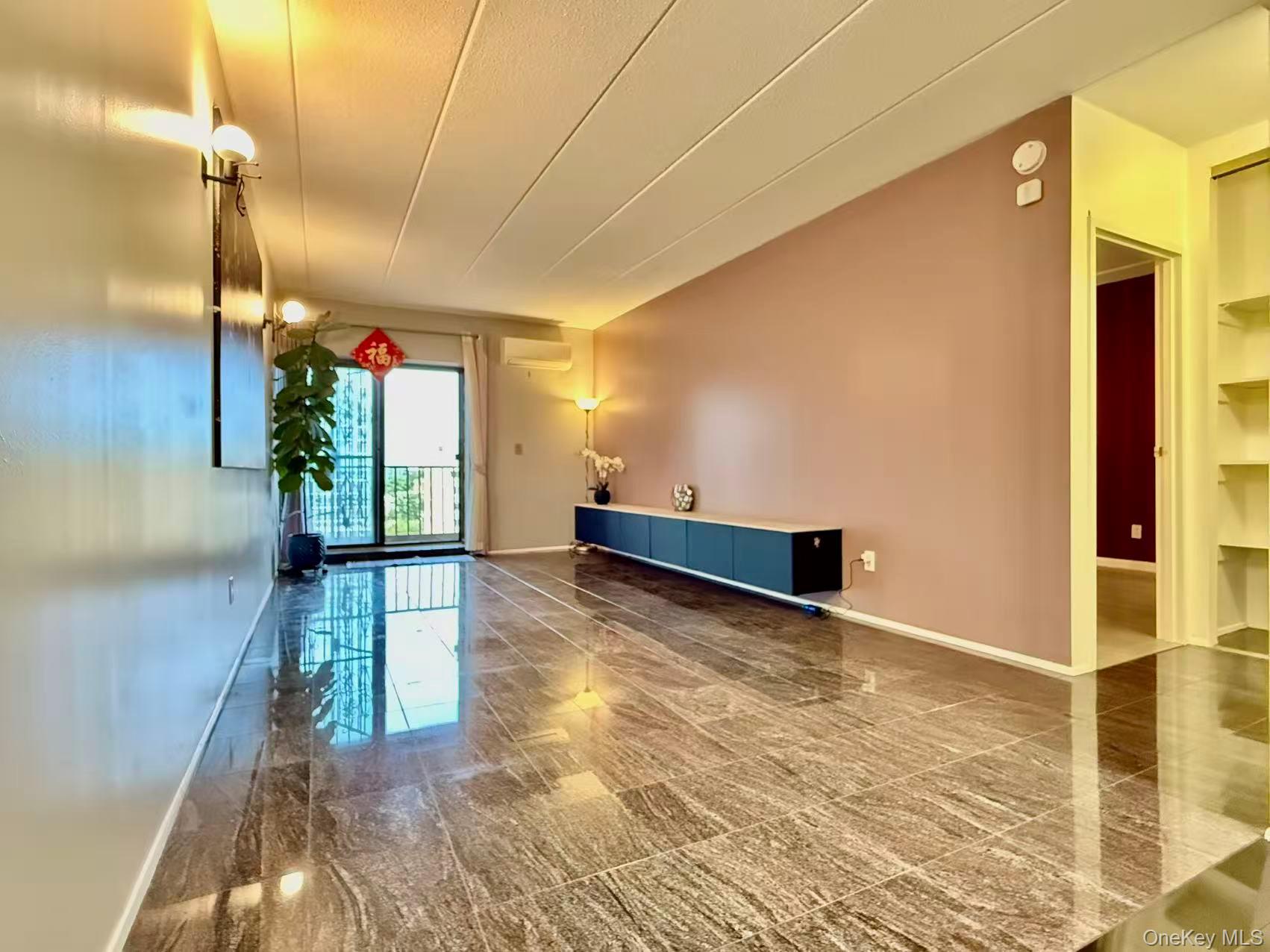 42-42 Union Street, Unit 9PHC Queens, NY 11355 - Photo 2 of 21 a view of empty room with wooden floor