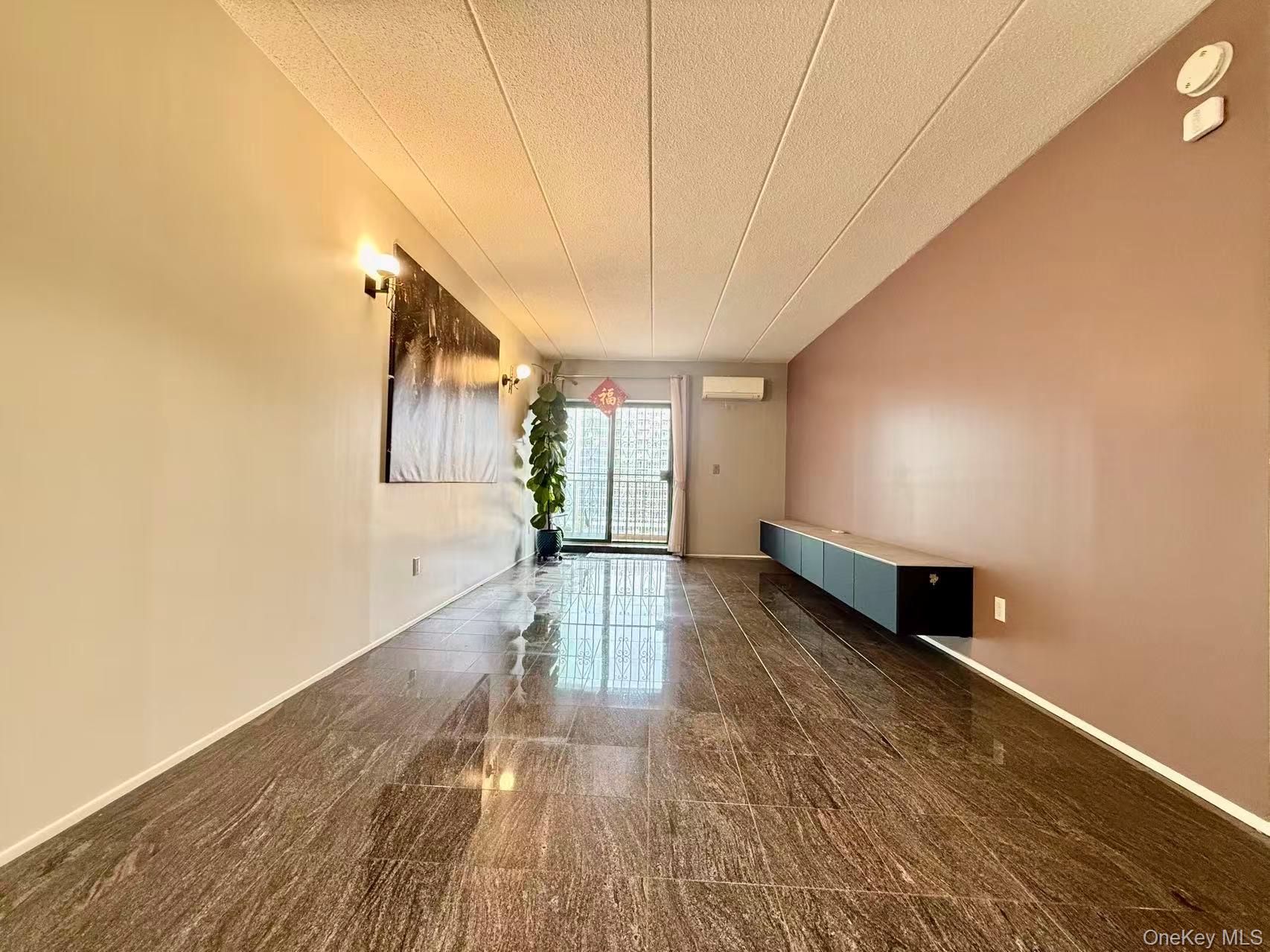 42-42 Union Street, Unit 9PHC Queens, NY 11355 - Photo 3 of 21 a view of empty room with wooden floor