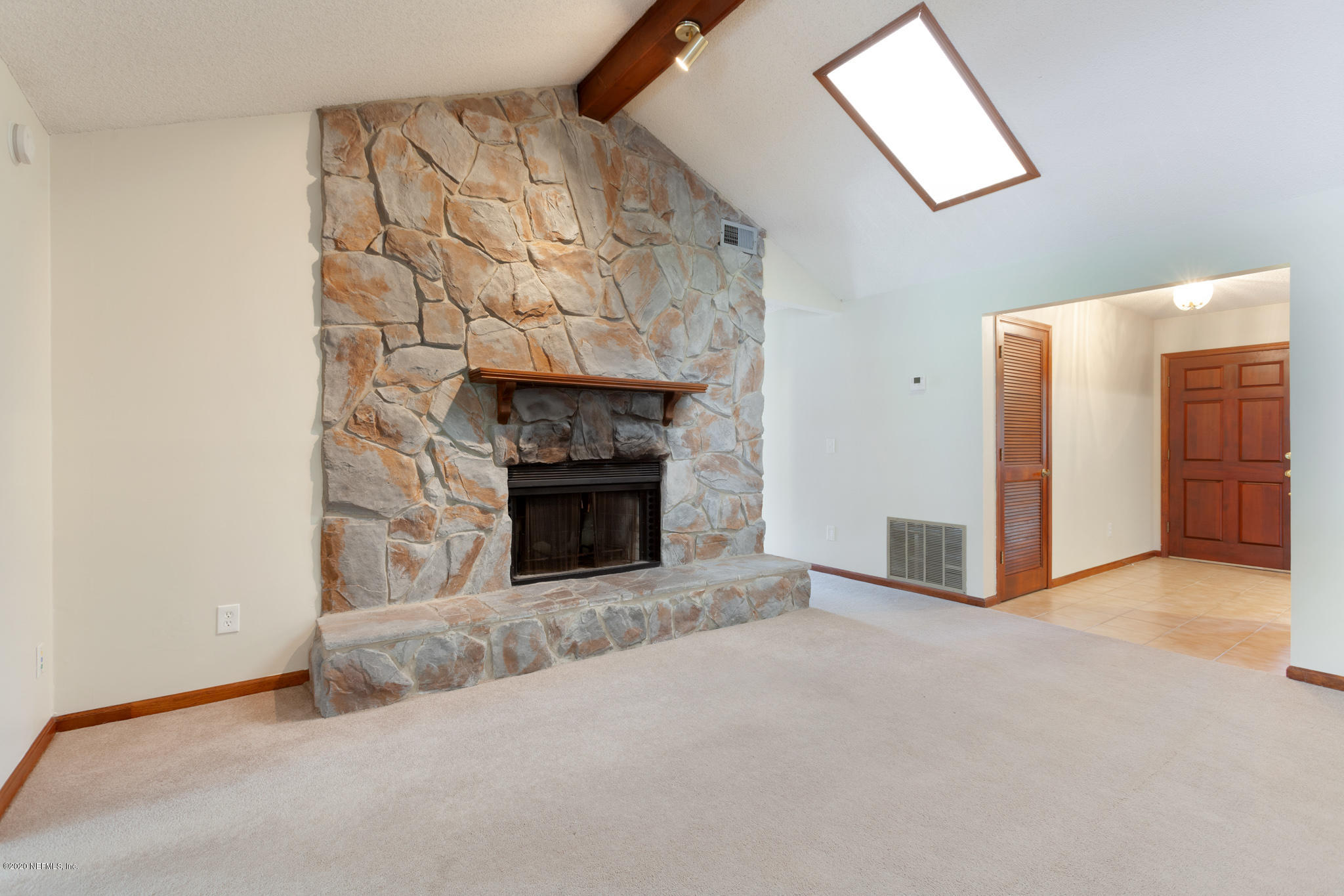 219 River Reach Road Fleming Island, FL 32003 - Photo 4 of 17 Fireplace and Foyer
