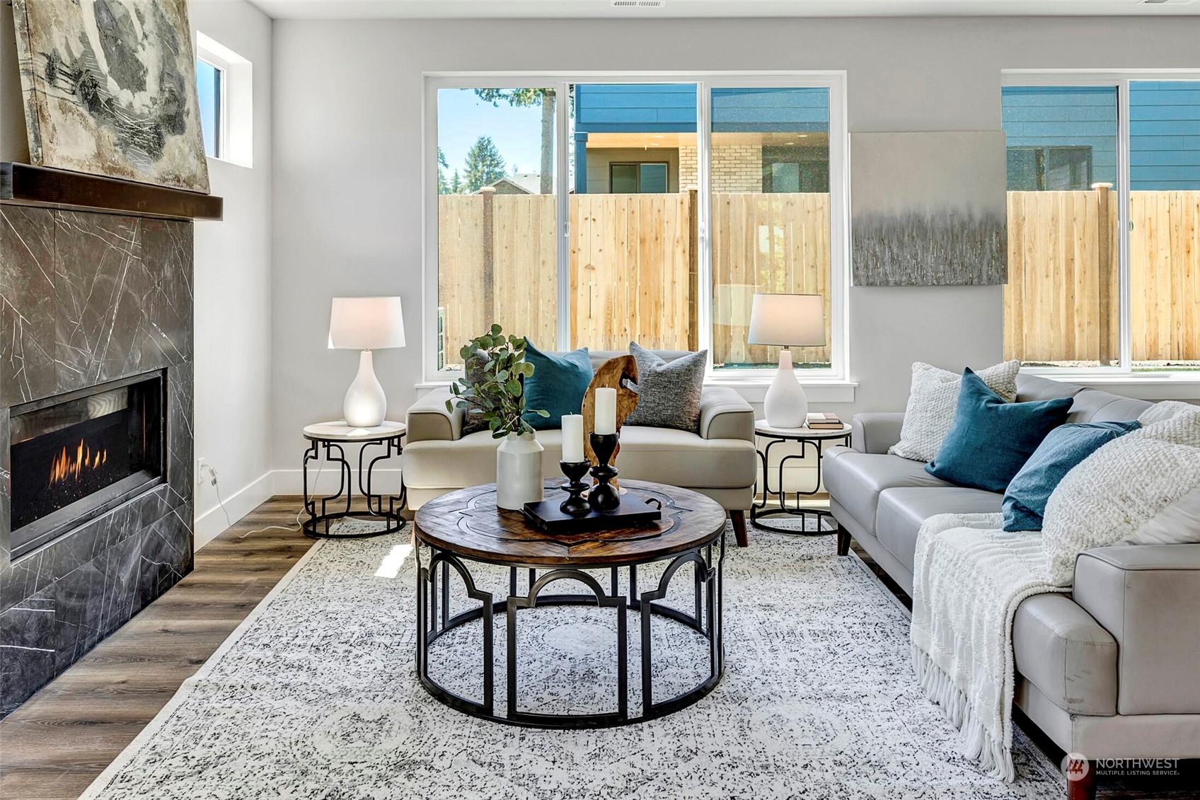 20 216th Street Southwest Bothell, WA 98021 - Photo 12 of 39 a living room with furniture a fireplace and a table