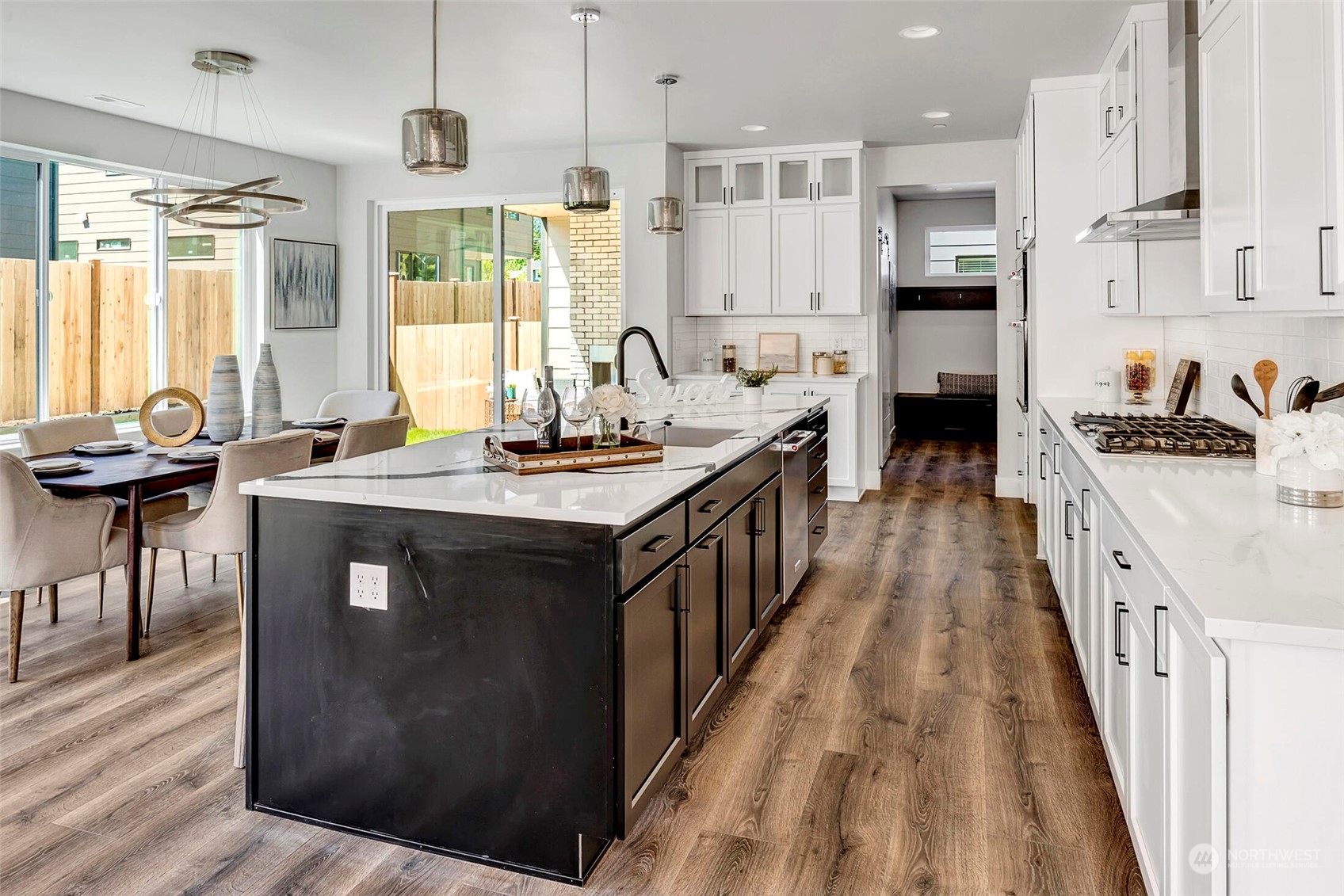 20 216th Street Southwest Bothell, WA 98021 - Photo 19 of 39 a kitchen with stainless steel appliances granite countertop a stove a sink dishwasher and a refrigerator with wooden floor