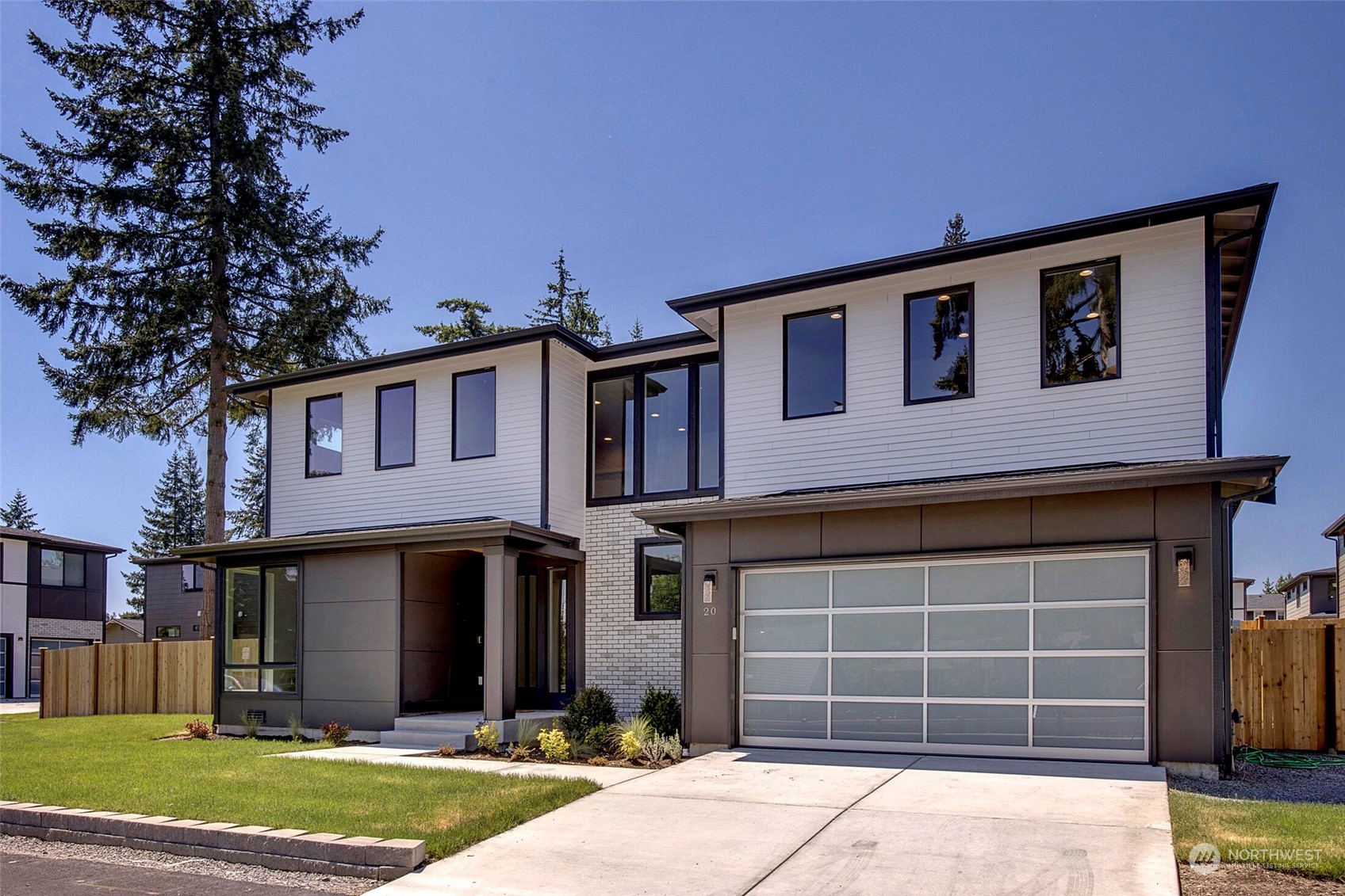 20 216th Street Southwest Bothell, WA 98021 - Photo 2 of 39 a front view of a house with a yard and garage