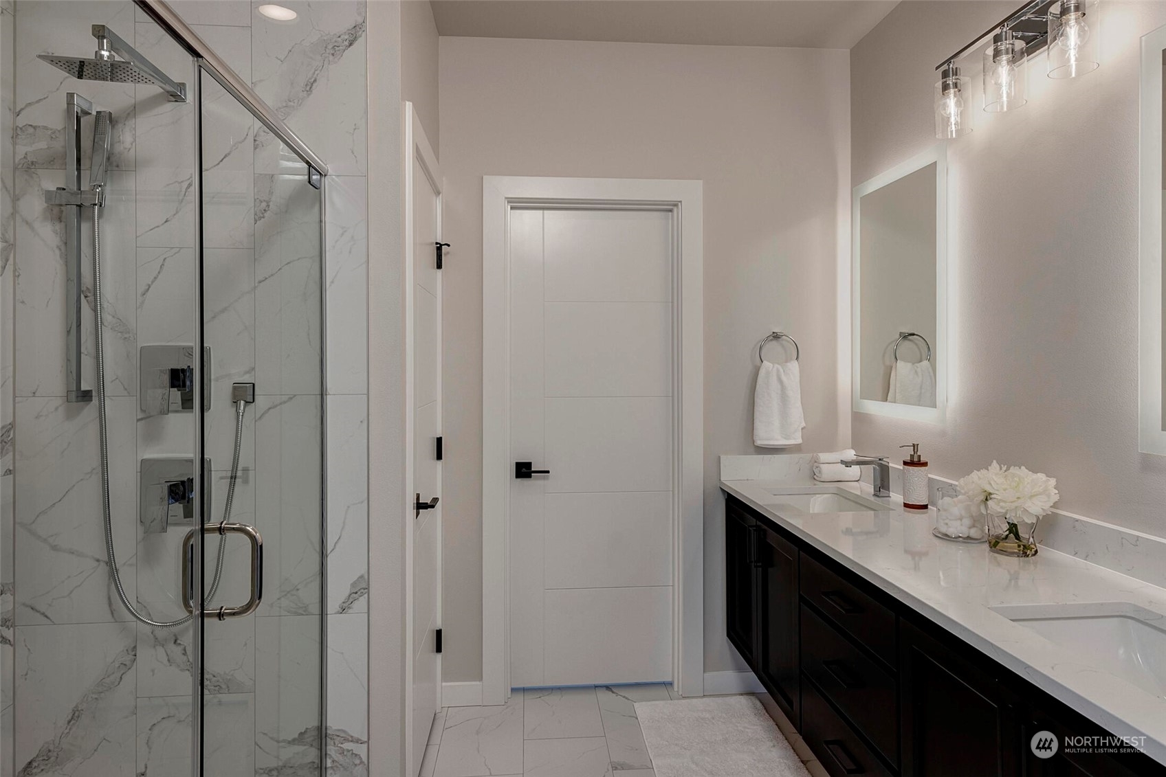 20 216th Street Southwest Bothell, WA 98021 - Photo 29 of 39 a bathroom with a double vanity sink a toilet and shower