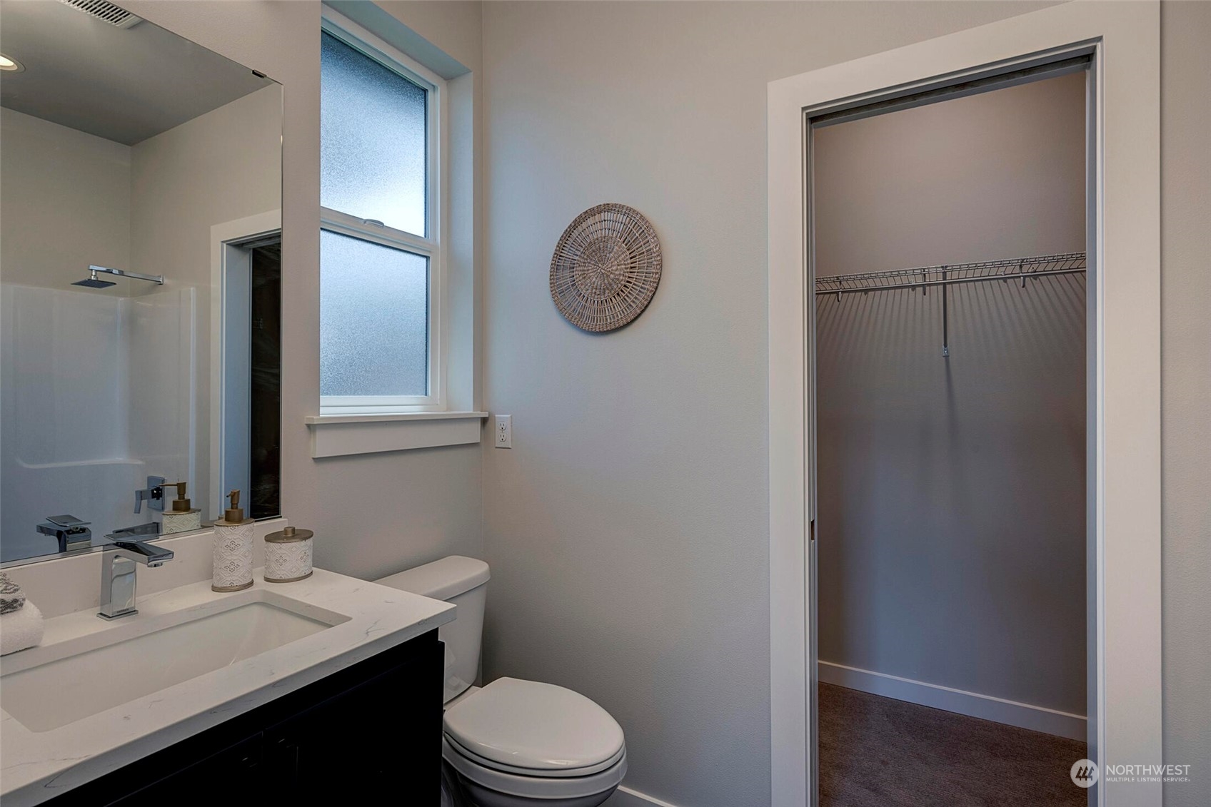 20 216th Street Southwest Bothell, WA 98021 - Photo 33 of 39 a bathroom with a toilet a sink and mirror