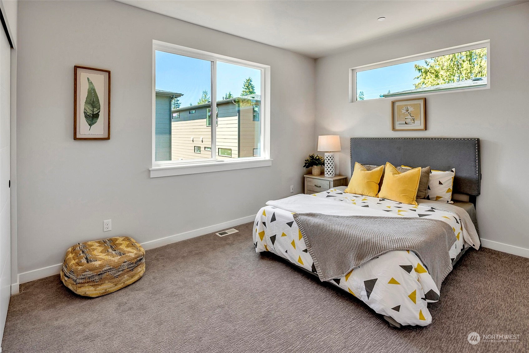 20 216th Street Southwest Bothell, WA 98021 - Photo 35 of 39 a bedroom with a bed and painting on the wall
