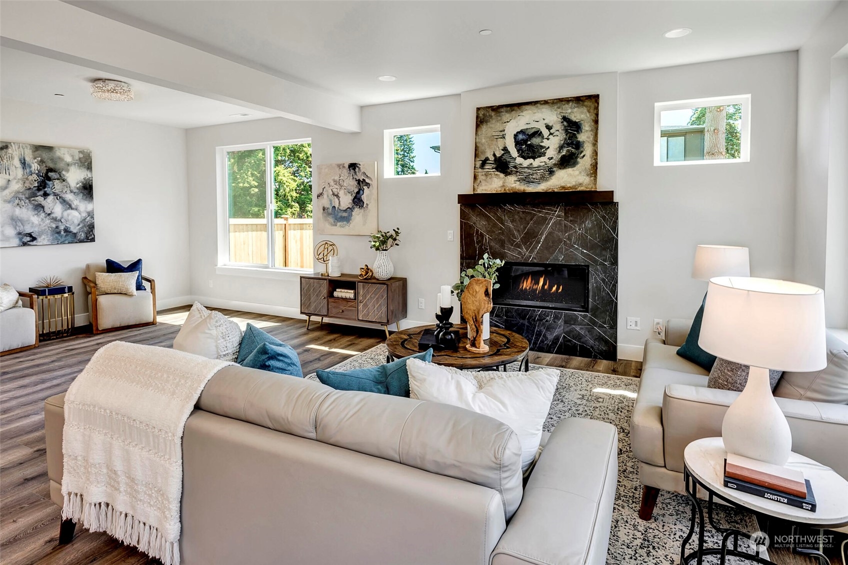 20 216th Street Southwest Bothell, WA 98021 - Photo 10 of 39 a living room with furniture and a fireplace