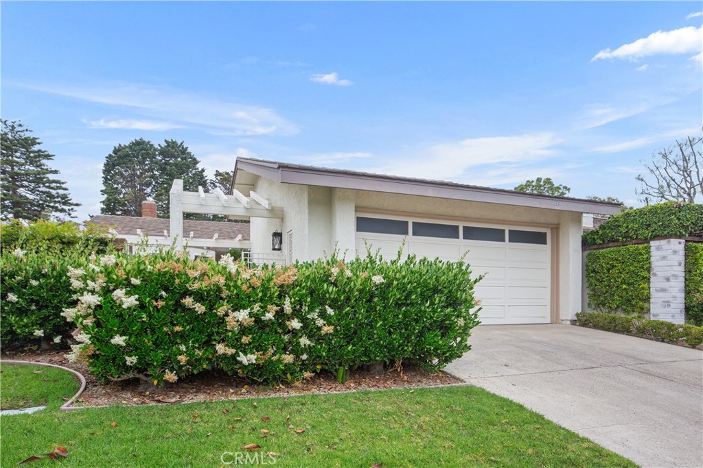 37 Beachcomber Drive Corona del Mar, CA 92625 - Photo 1 of 39 a view of a house with a yard and plants