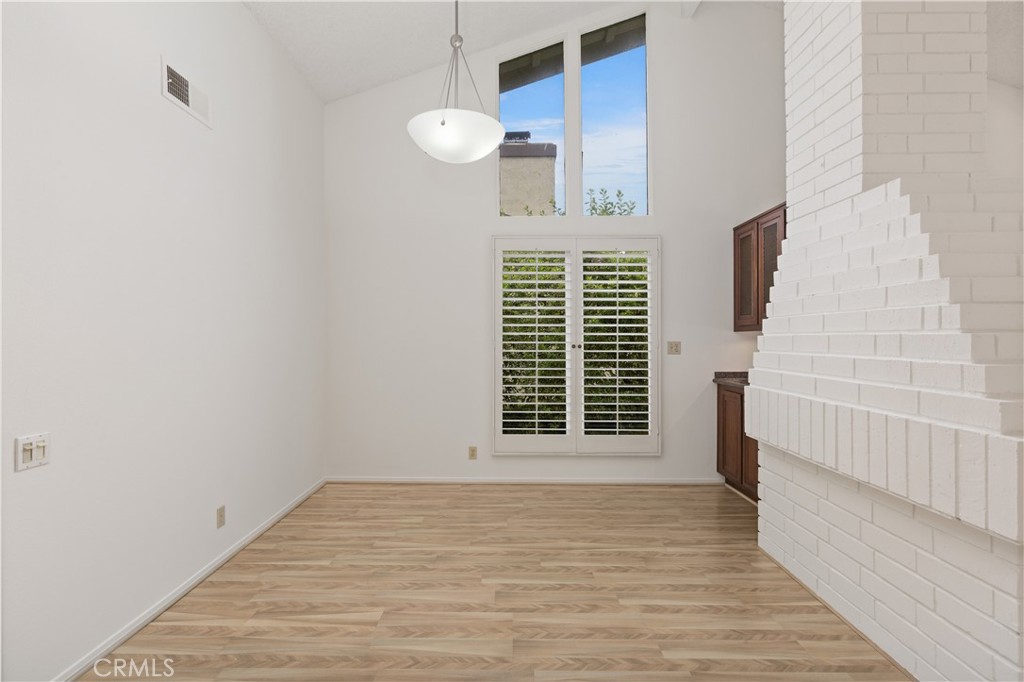 37 Beachcomber Drive Corona del Mar, CA 92625 - Photo 13 of 39 a view of an empty room with wooden floor and a window