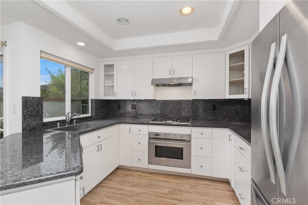 37 Beachcomber Drive Corona del Mar, CA 92625 - Photo 18 of 39 a kitchen with stainless steel appliances granite countertop a stove and a sink