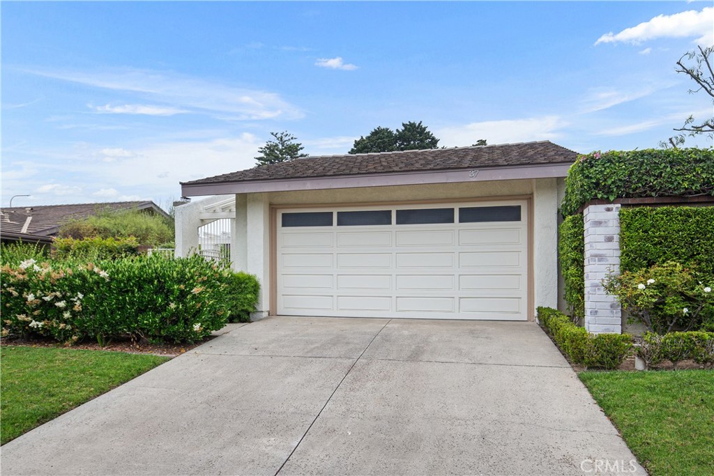 37 Beachcomber Drive Corona del Mar, CA 92625 - Photo 2 of 39 front view of a house with a yard