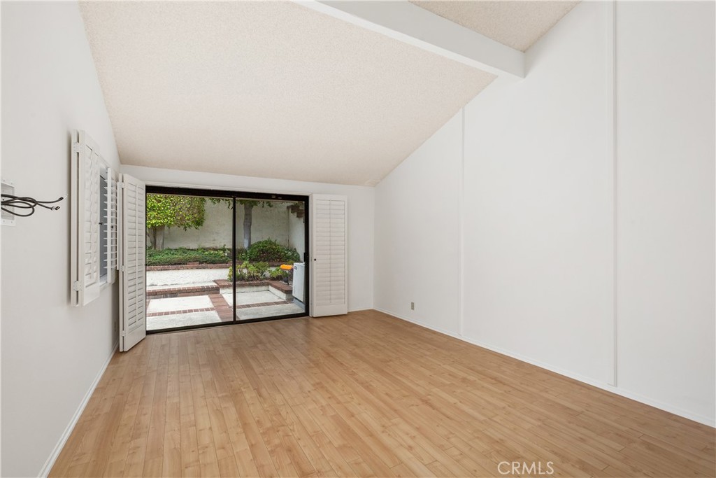 37 Beachcomber Drive Corona del Mar, CA 92625 - Photo 24 of 39 an empty room with wooden floor and windows