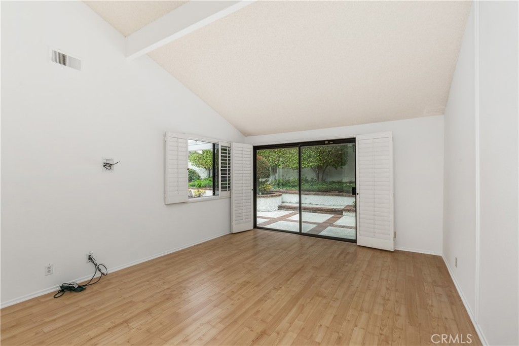37 Beachcomber Drive Corona del Mar, CA 92625 - Photo 25 of 39 an empty room with wooden floor and windows