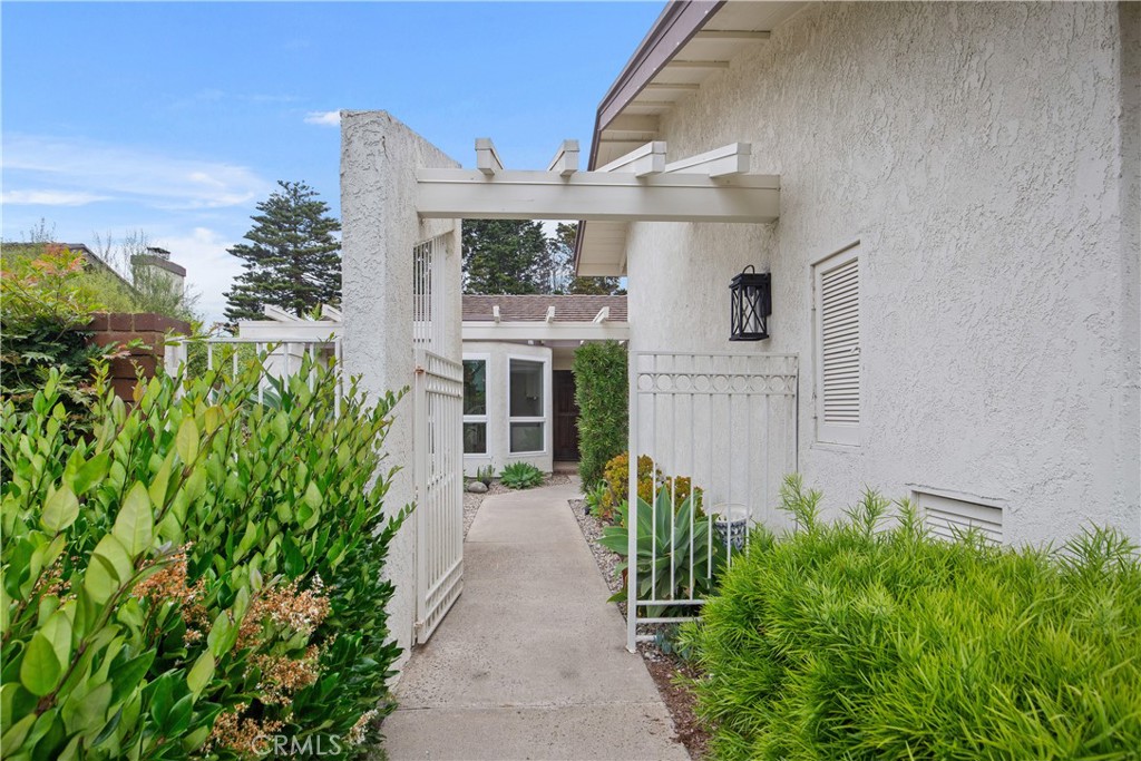 37 Beachcomber Drive Corona del Mar, CA 92625 - Photo 3 of 39 a front view of a house with a garden