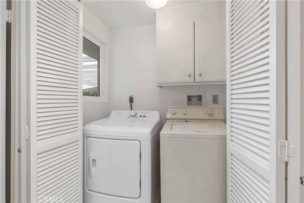 37 Beachcomber Drive Corona del Mar, CA 92625 - Photo 33 of 39 a utility room with dryer and washer