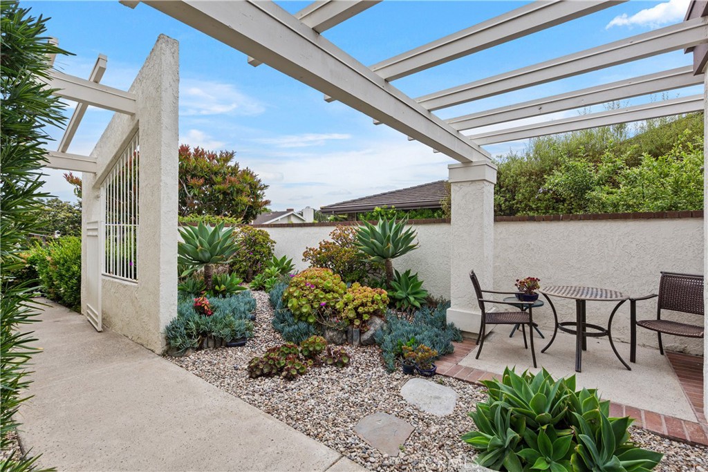 37 Beachcomber Drive Corona del Mar, CA 92625 - Photo 5 of 39 a view of outdoor dining space with plants and furniture