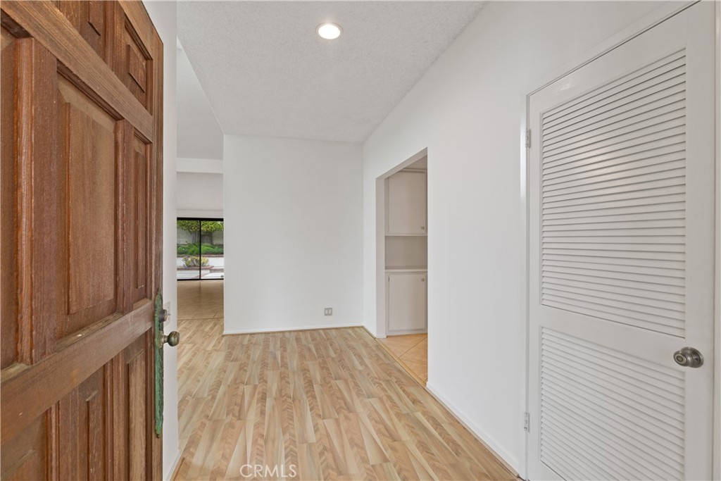 37 Beachcomber Drive Corona del Mar, CA 92625 - Photo 6 of 39 a view of a room with wooden floor staircase and bathroom