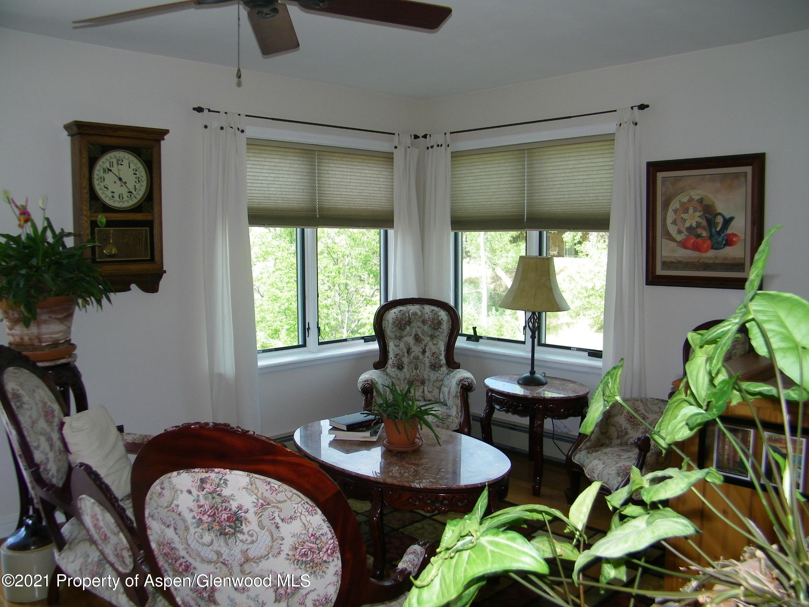 680 Moki Avenue Rifle, CO 81650 - Photo 17 of 39 a view of a livingroom with furniture and a potted plant