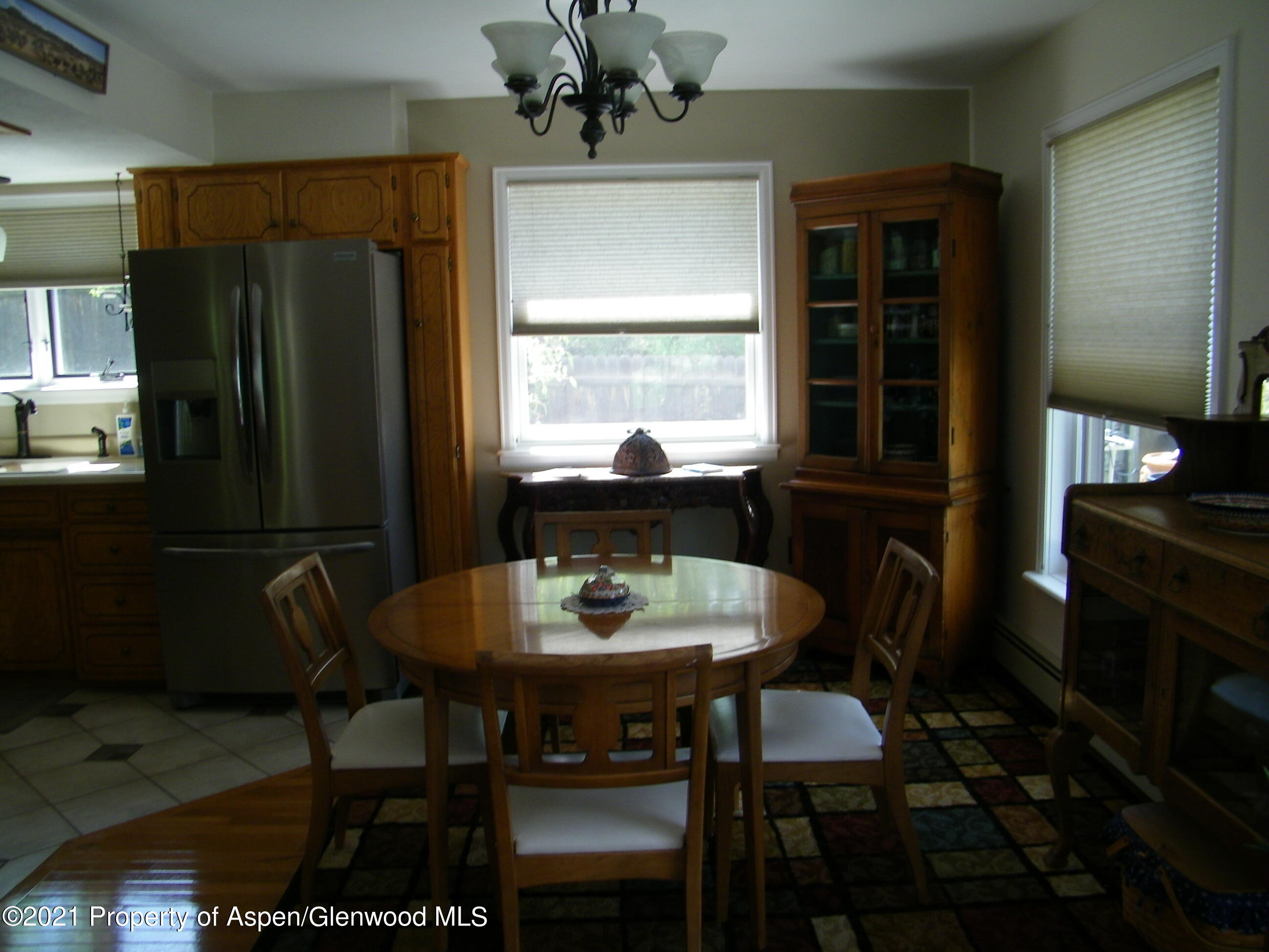 680 Moki Avenue Rifle, CO 81650 - Photo 25 of 39 a view of a dining room with furniture window and outside view
