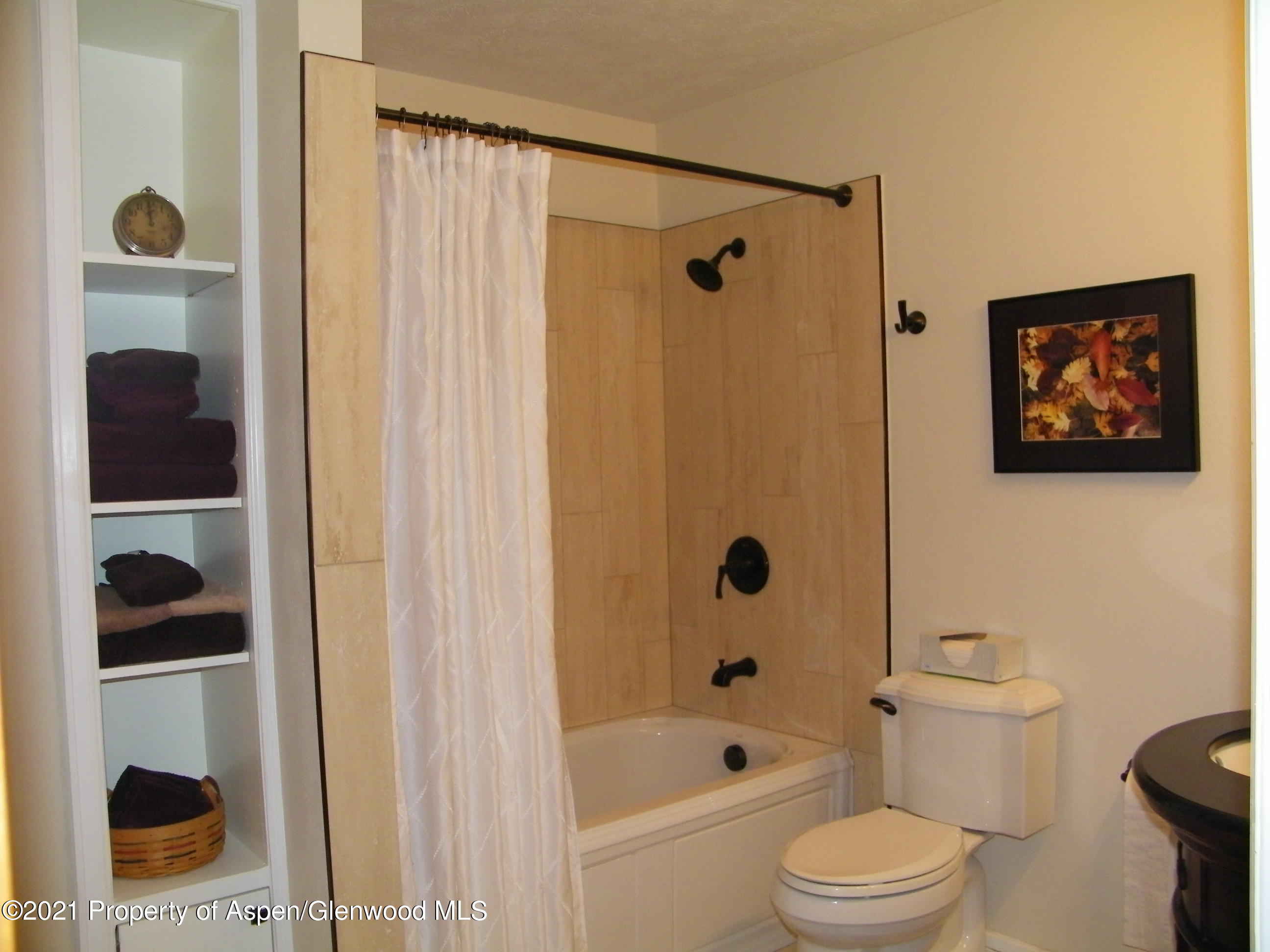 680 Moki Avenue Rifle, CO 81650 - Photo 26 of 39 a bathroom with a toilet and a shower