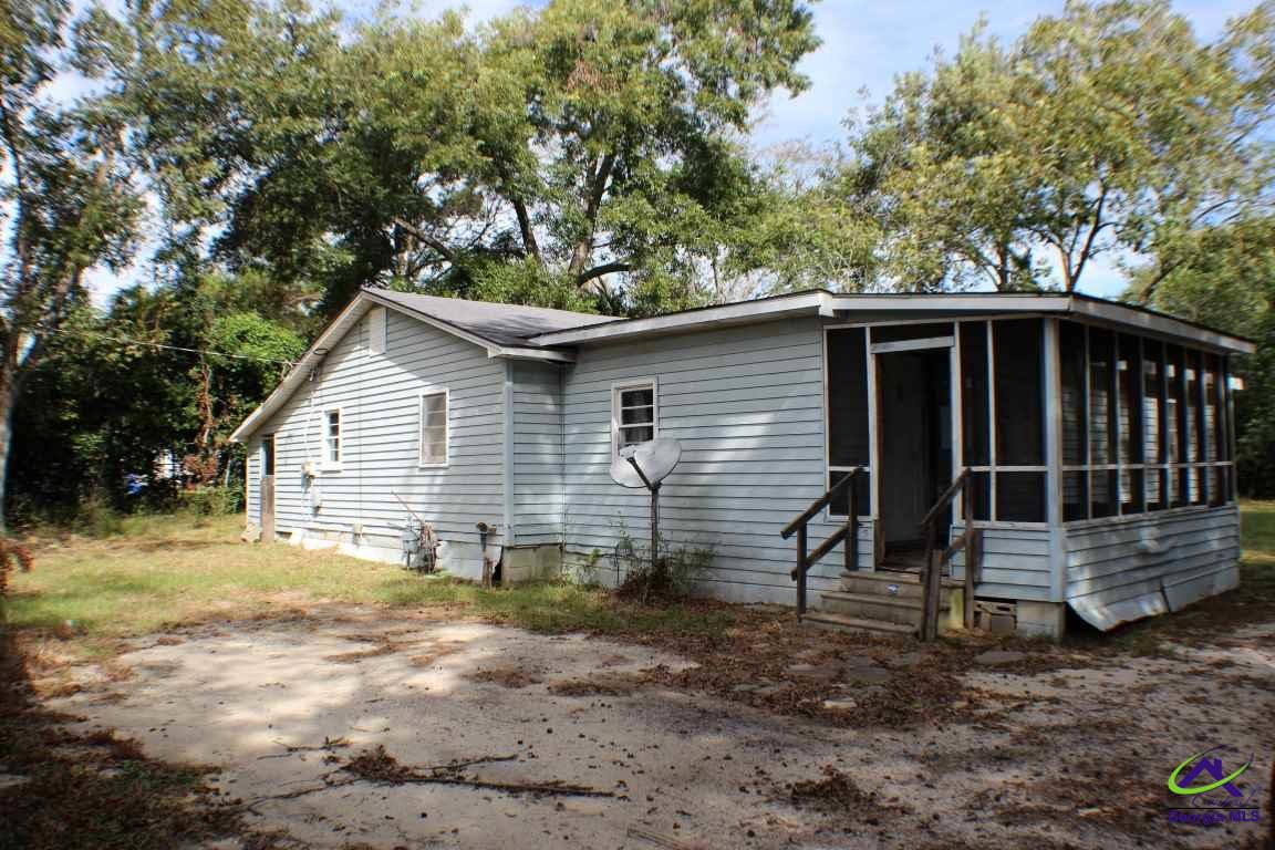 165 Vernon Road Cochran, GA 31014 - Photo 1 of 1 a view of a house with a yard and wooden fence
