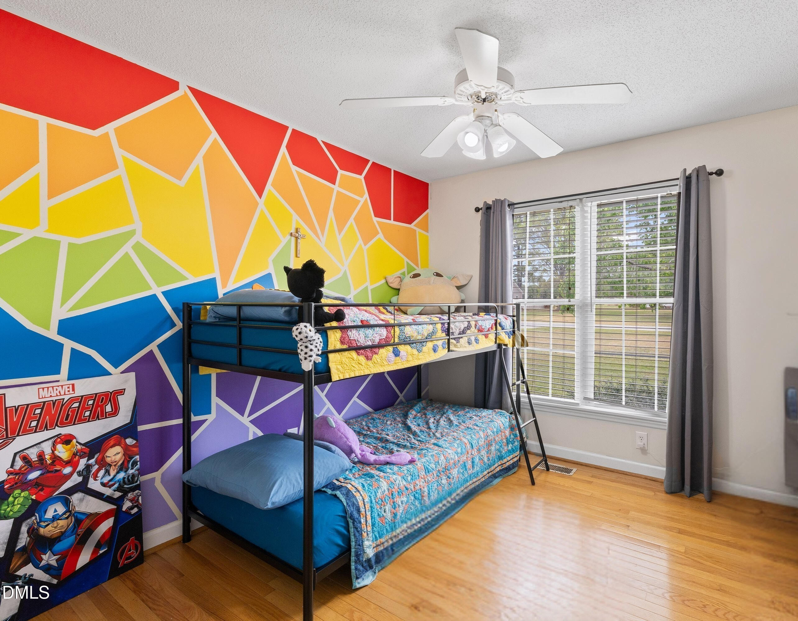 724 Iris Bryant Road Dunn, NC 28334 - Photo 11 of 22 a bedroom with a bed and glass window