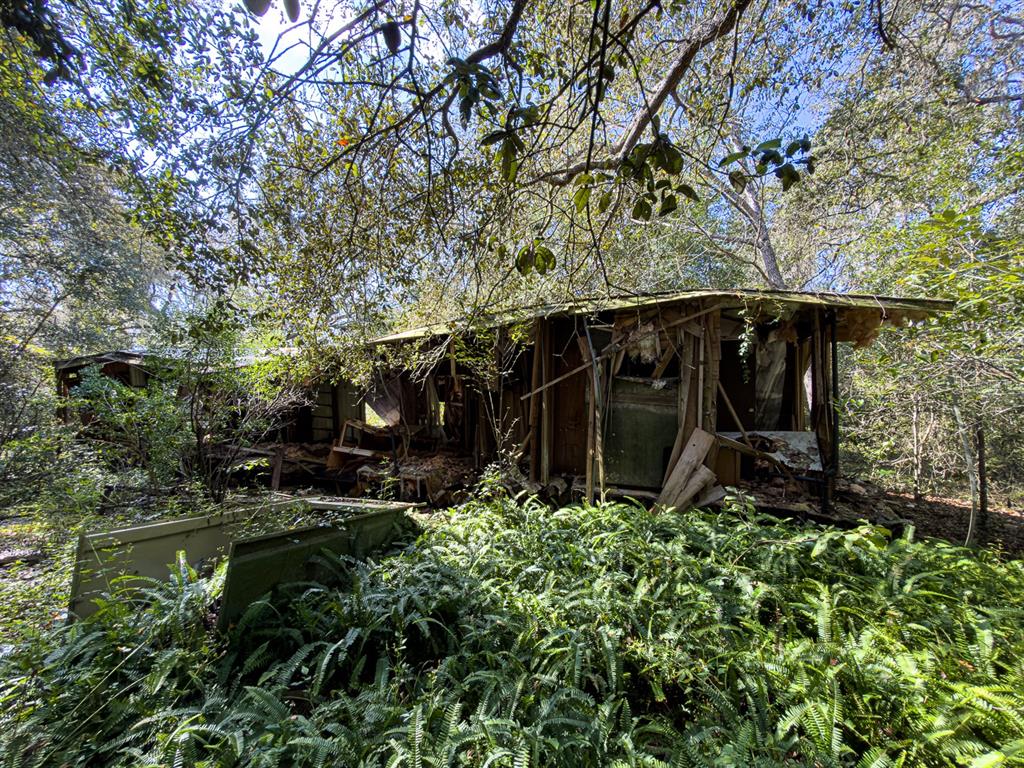 34095 Hyatt Road Dade City, FL 33523 - Photo 26 of 41 front view of a house with a yard