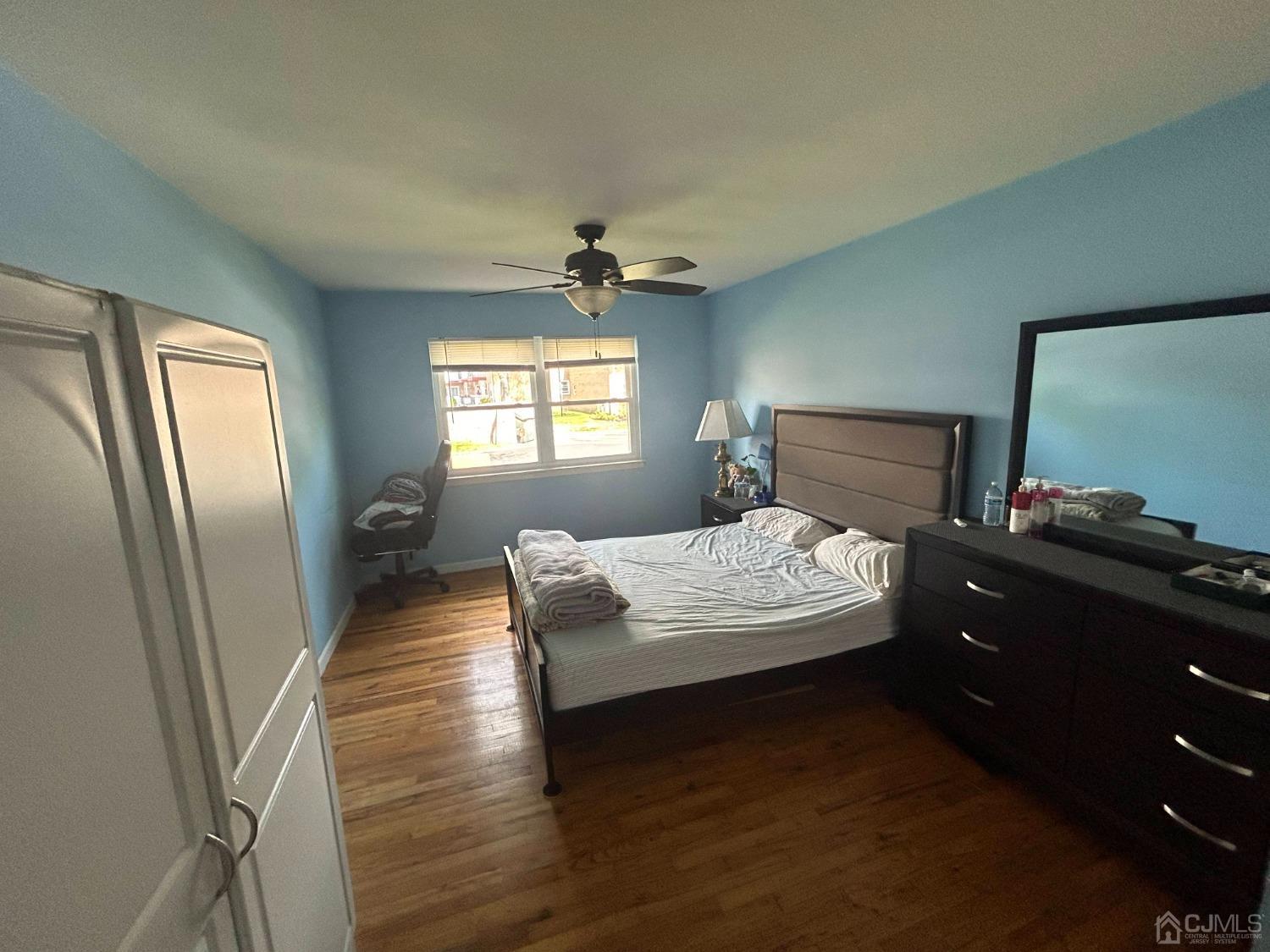 44 Judson Street, Unit 5A Edison, NJ 08837 - Photo 2 of 5 a bedroom with a bed and window