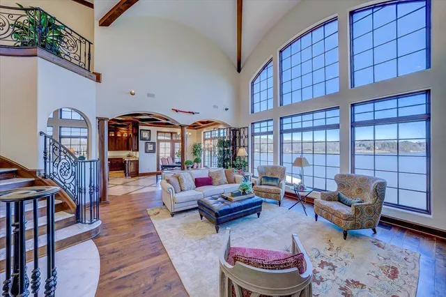 a dining room with furniture wooden floor and a potted plant