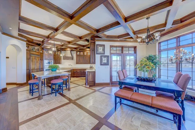 a bathroom with a granite countertop sink a large mirror and a window