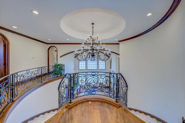 a living room with furniture a table and wooden floor