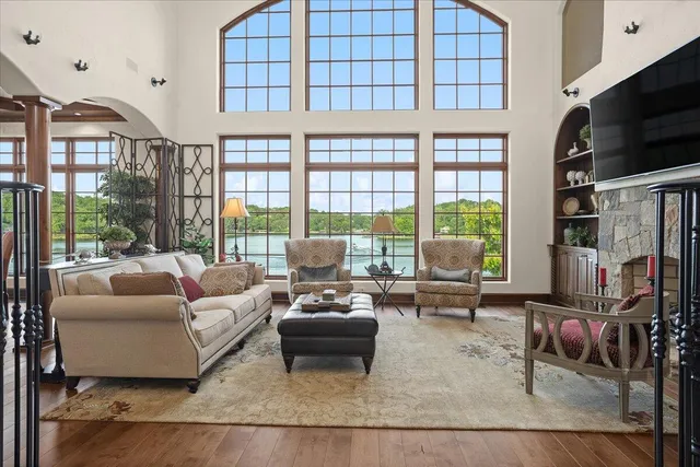 a view of a kitchen with kitchen island stainless steel appliances a stove a sink and a refrigerator