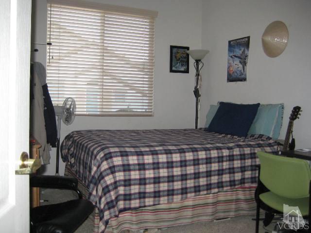 657 Cardinal Ridge Lane Simi Valley, CA 93065 - Photo 12 of 14 a bedroom with a bed and a window