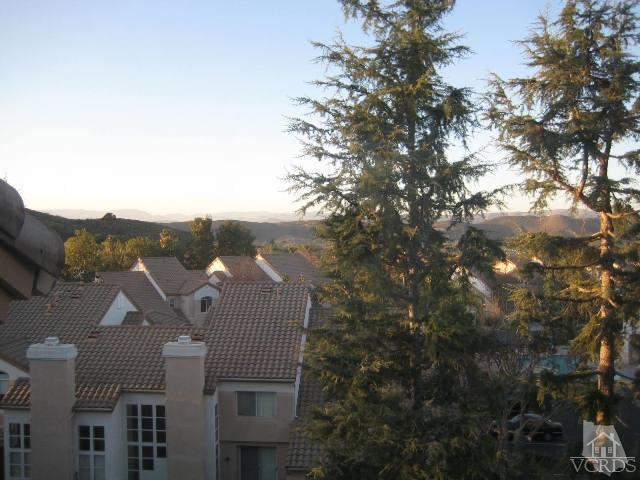 657 Cardinal Ridge Lane Simi Valley, CA 93065 - Photo 13 of 14 a view of a house with a yard from a sink