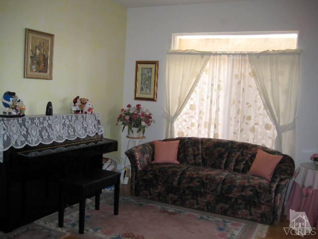 657 Cardinal Ridge Lane Simi Valley, CA 93065 - Photo 4 of 14 a living room with furniture and a window