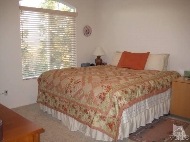 657 Cardinal Ridge Lane Simi Valley, CA 93065 - Photo 9 of 14 a bedroom with a bed and a window