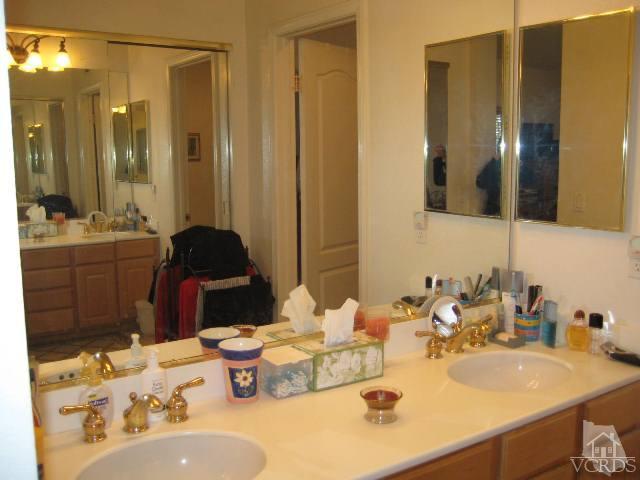 657 Cardinal Ridge Lane Simi Valley, CA 93065 - Photo 10 of 14 a bathroom with a sink double vanity and a mirror