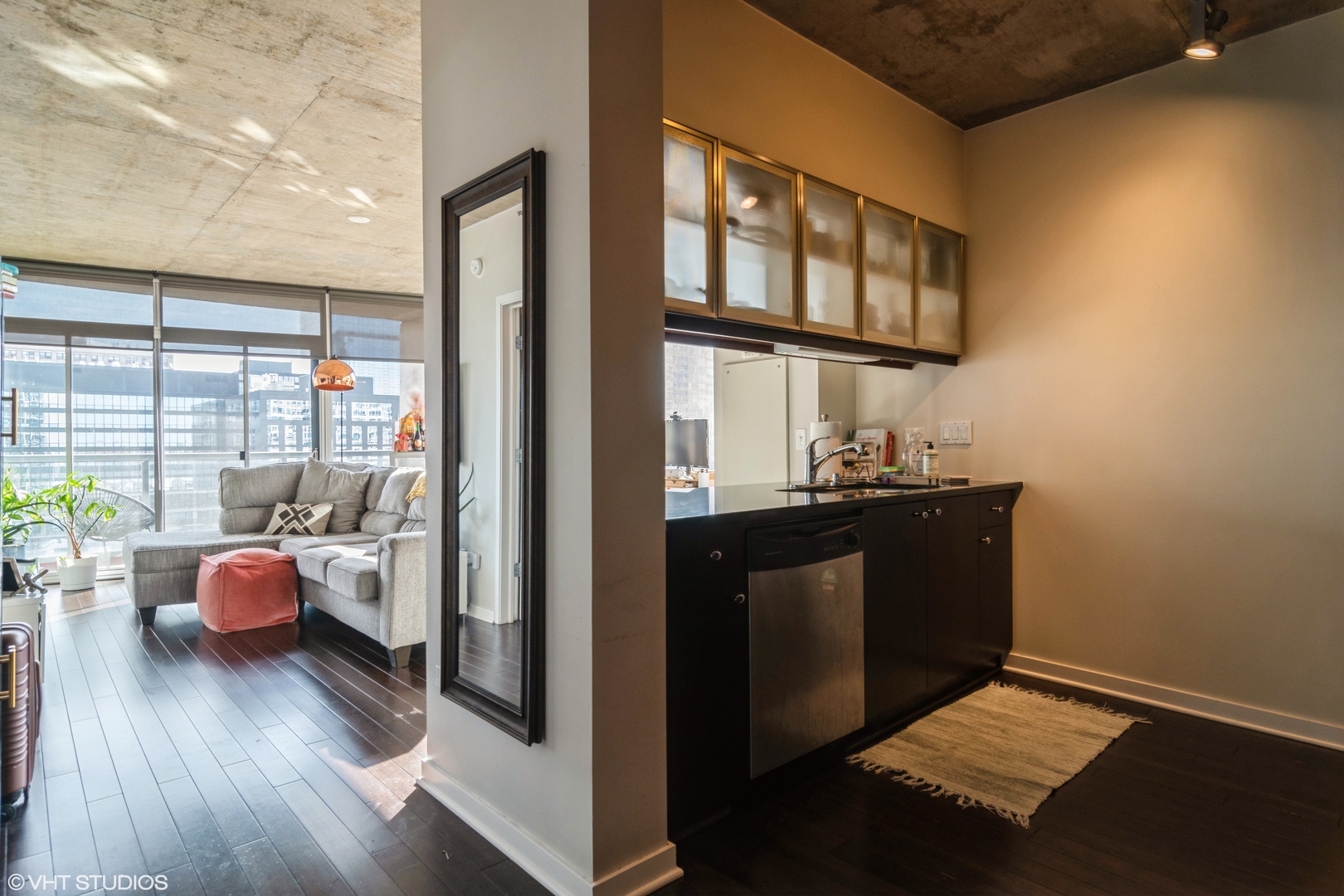 611 South Wells Street, Unit 1608 Chicago, IL 60607 - Photo 3 of 15 a view of living room and kitchen with wooden floor