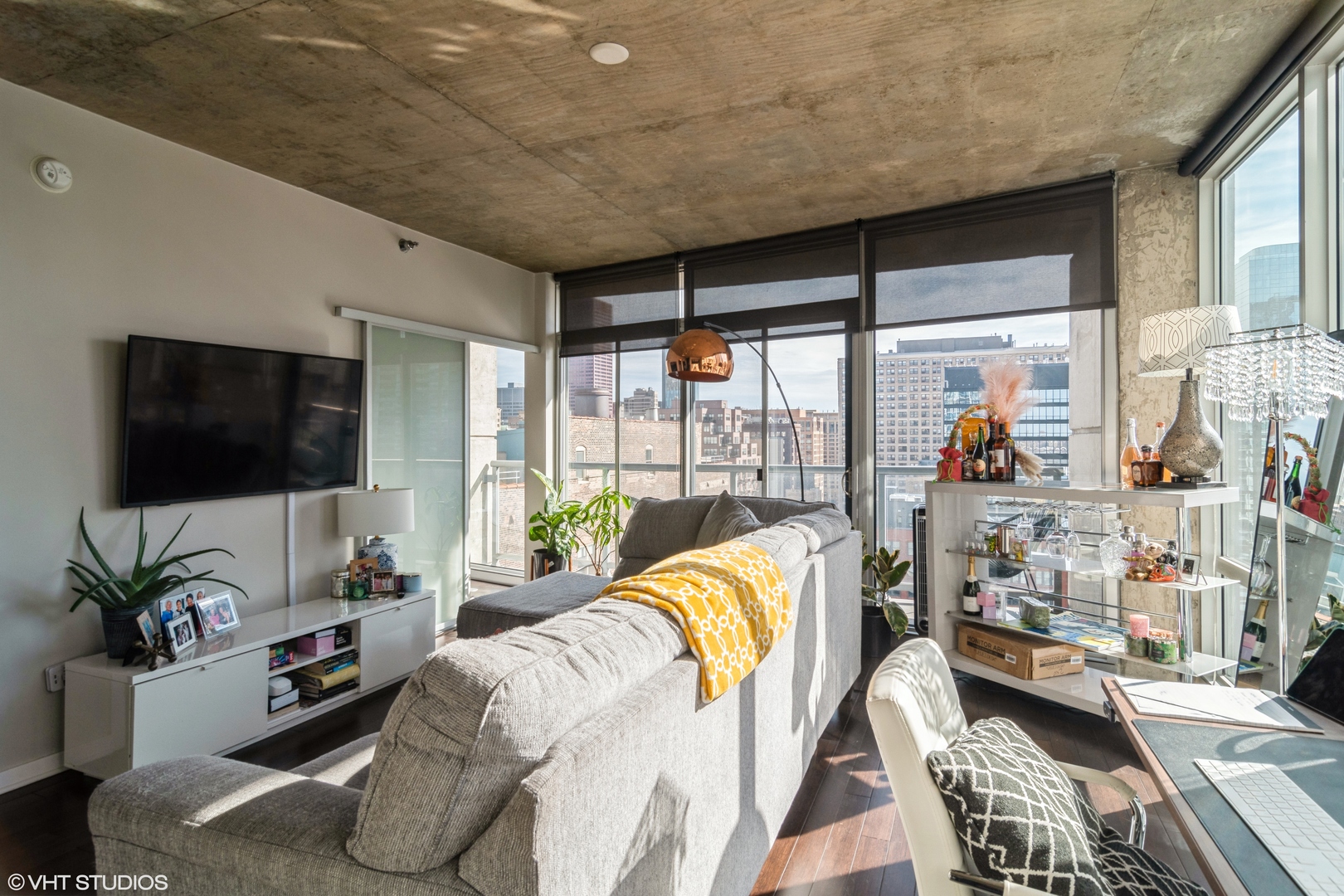 611 South Wells Street, Unit 1608 Chicago, IL 60607 - Photo 4 of 15 a living room with furniture and a flat screen tv