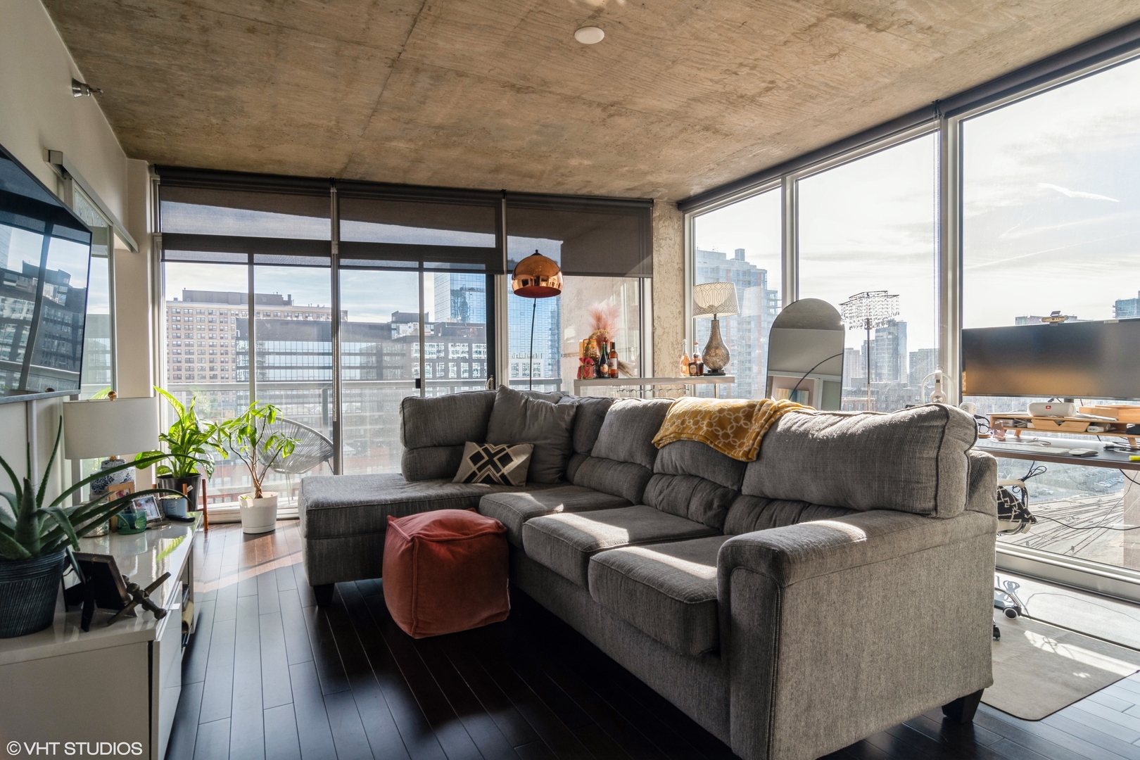 611 South Wells Street, Unit 1608 Chicago, IL 60607 - Photo 6 of 15 a living room with furniture floor to ceiling window and wooden floor