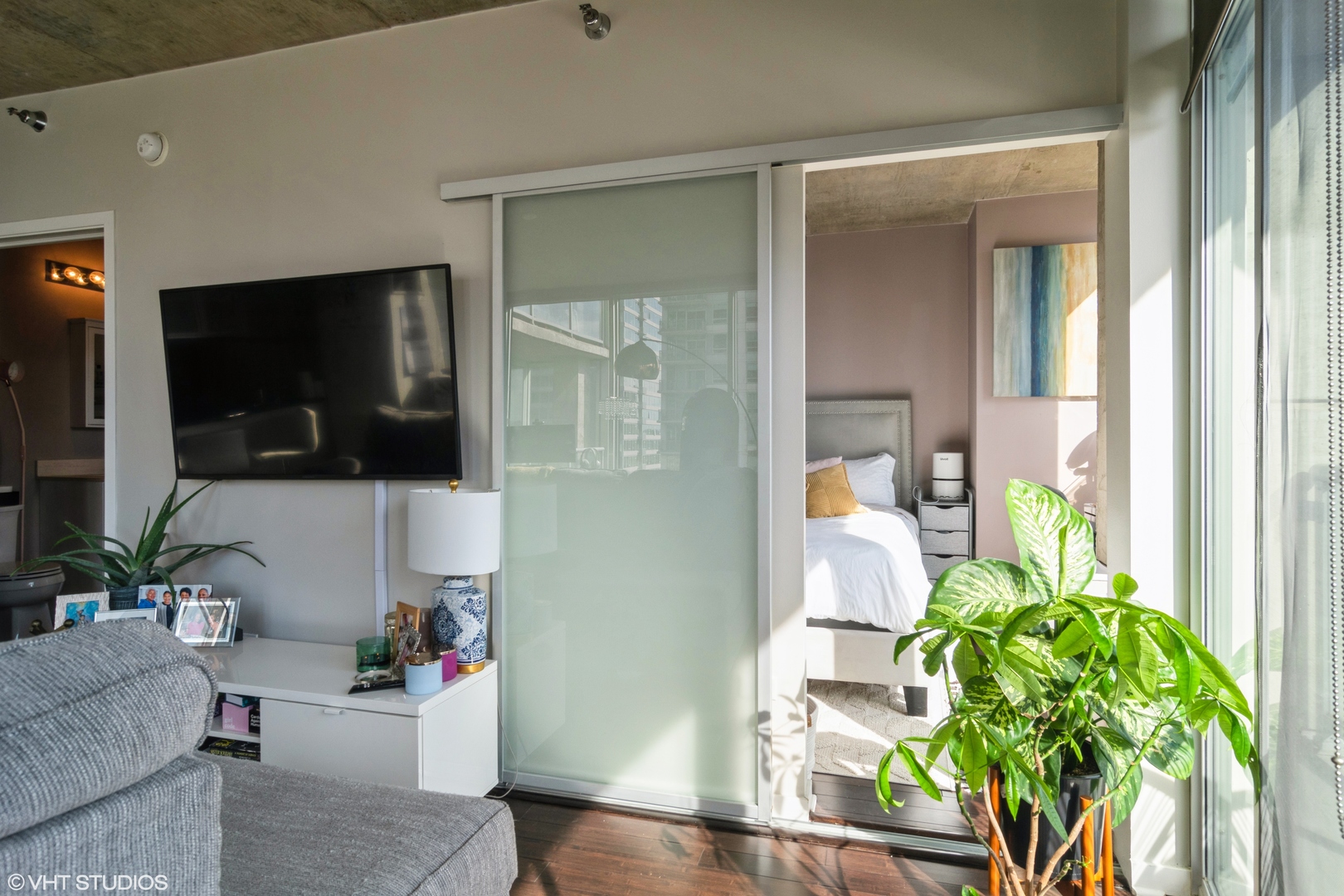 611 South Wells Street, Unit 1608 Chicago, IL 60607 - Photo 8 of 15 a living room with furniture and a flat screen tv