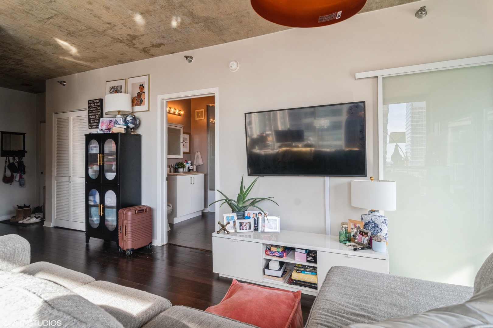 611 South Wells Street, Unit 1608 Chicago, IL 60607 - Photo 10 of 15 a living room with furniture and a flat screen tv