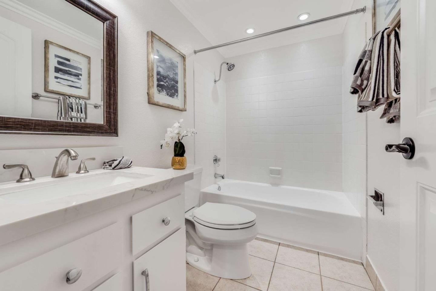 829 Montgomery Street Mountain View, CA 94041 - Photo 17 of 36 a bathroom with a granite countertop sink a toilet and shower