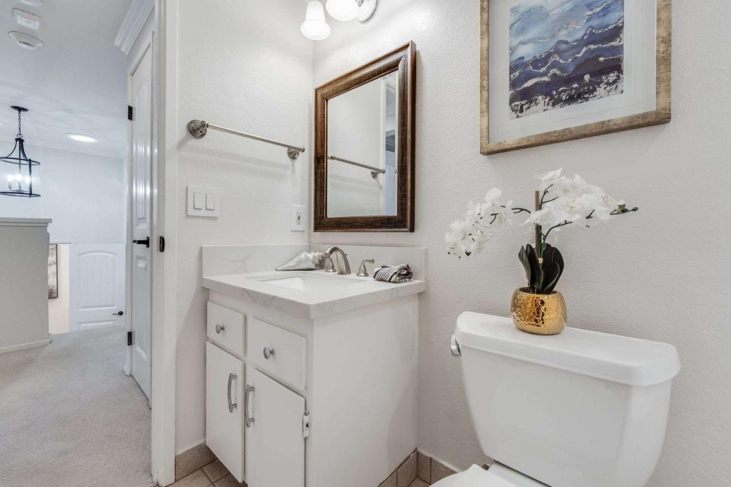 829 Montgomery Street Mountain View, CA 94041 - Photo 18 of 36 a bathroom with a sink a mirror and a shower