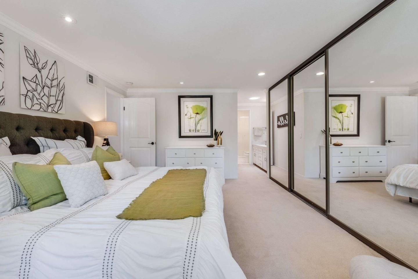 829 Montgomery Street Mountain View, CA 94041 - Photo 23 of 36 a spacious bedroom with a bed and furniture