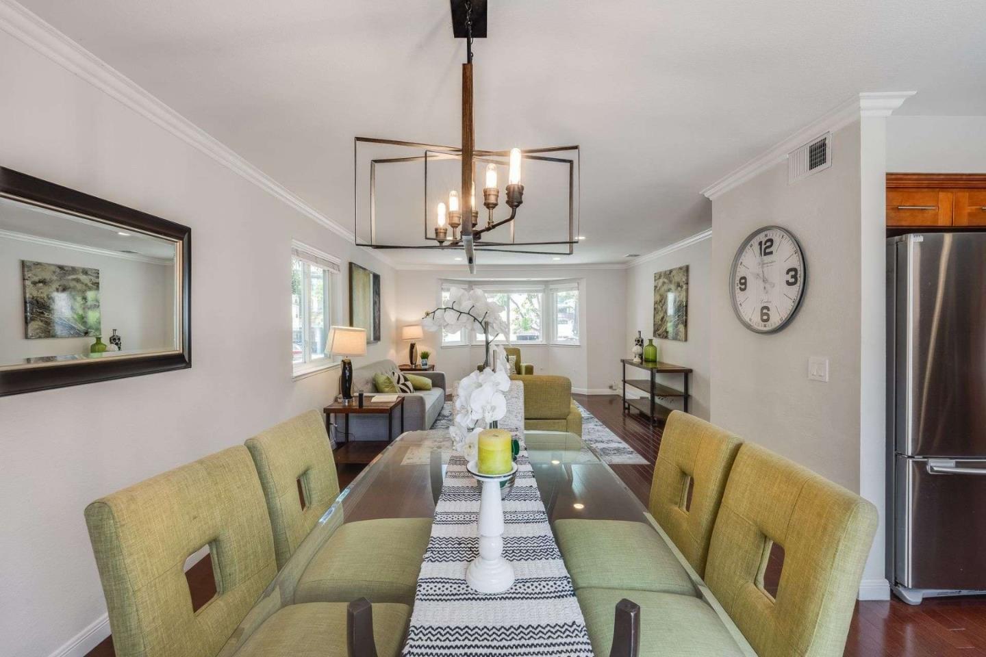829 Montgomery Street Mountain View, CA 94041 - Photo 9 of 36 a view of a dining room with furniture a chandelier and wooden floor