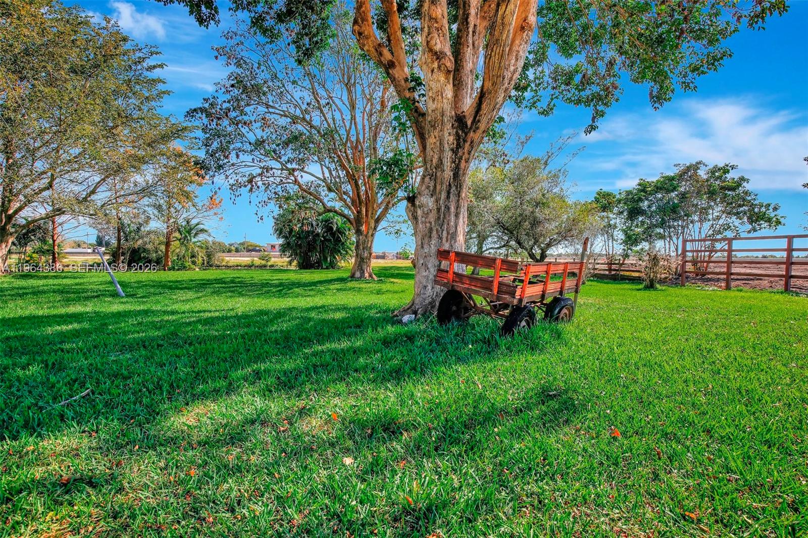 14799 Southwest 48th Court Miramar, FL 33027 - Photo 18 of 34 a backyard of a house with table and chairs