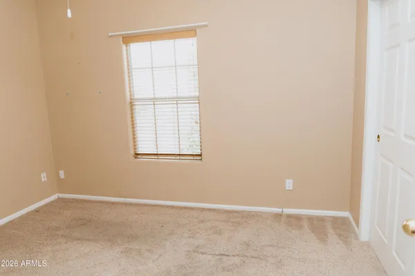 a view of utility room with wooden floor
