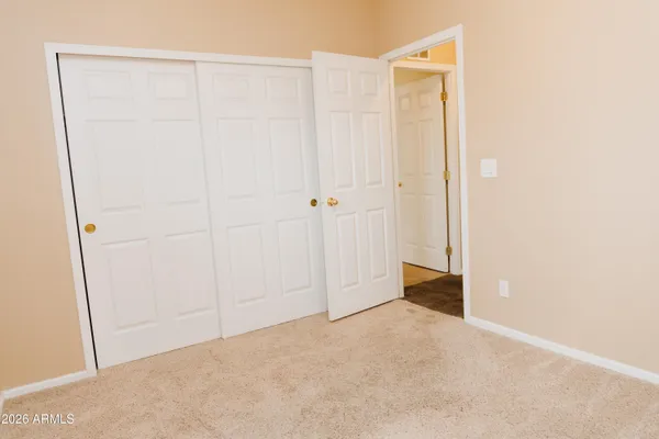 a view of a bathroom with a sink and wooden floor