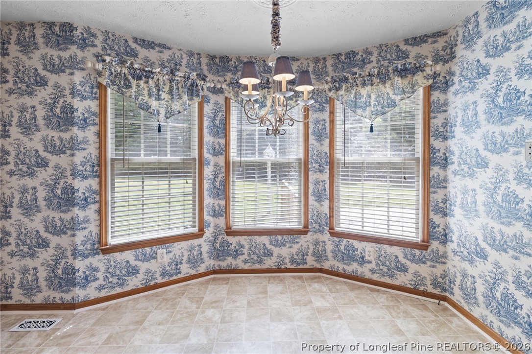 28 Coyt Circle Spring Lake, NC 28390 - Photo 12 of 41 a view of a chandelier and window in a room